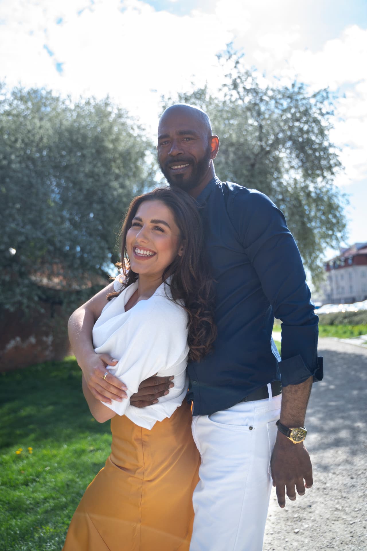 Christian couple laughing together outdoors